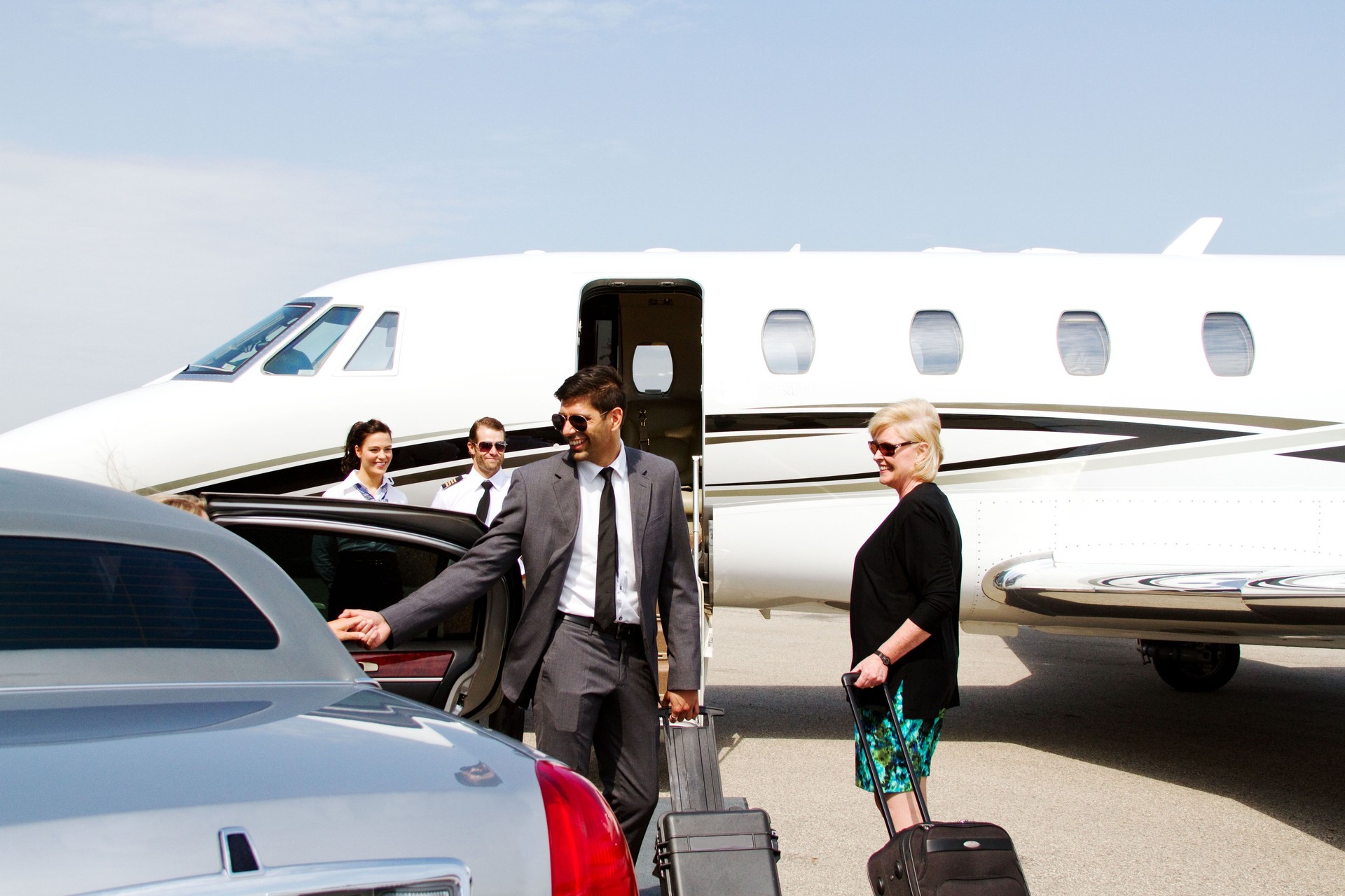 Lady being assisted by chauffeur
